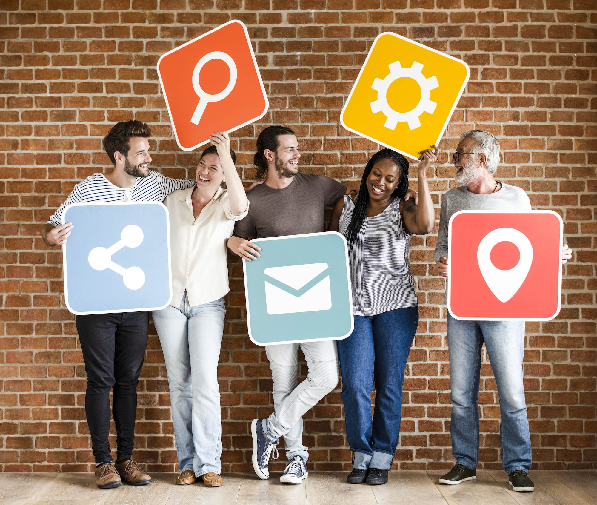 Diverse group of people holding icons for search, share, settings, mail, and location.