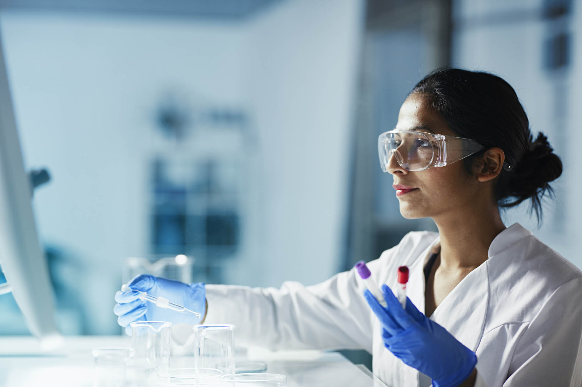 Female scientist conducting an experiment in a lab.