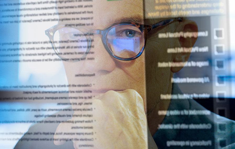 A composite image of a man with glasses overlaid with screen text, reflecting a focus on digital data and analytics.